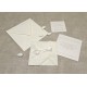 Partecipazione di nozze a origami con carta decoro, nastrini di organza e raso. Interno di carta seta.