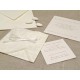 Partecipazione di nozze a origami con carta decoro, nastrini di organza e raso. Interno di carta seta.