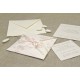 Partecipazione di nozze a origami con carta provenza rosa, nastrini di organza e raso. Interno di carta seta.