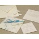 Partecipazione origami con carta provenza celeste, nastrini di organza e raso. Interno di carta seta.