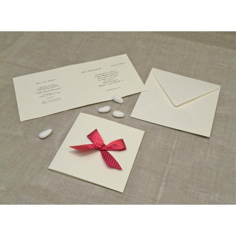 Wedding card in mulberry paper with red satin bow with polka dots