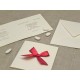 Partecipazione di nozze in carta di gelso con fiocco in raso rosso a Pois bianchi