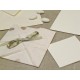 Partecipazione di nozze origami con petali a cuore, nastrini di organza e raso. Interno di carta seta.