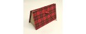 Document holder with compartments lined with tartan fabric closure leather lace and red frogging closed.