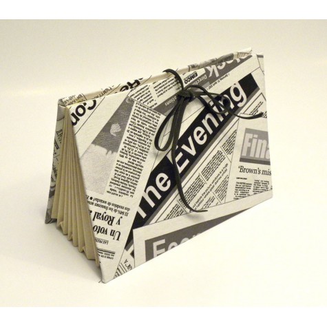 Documents compartments covered in fabric printed newspaper with closure leather lace