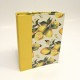 Cookbook made with paper printed with lemons and yellow canvas back