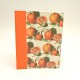 Cookbook made with paper prints with oranges and orange canvas back