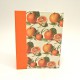 Ricettario da cucina con dorso in tela cialux arancio e copertina rivestita di carta con stampa "arancie"