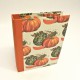 Cookbook made with paper prints with pumpkins and orange canvas back